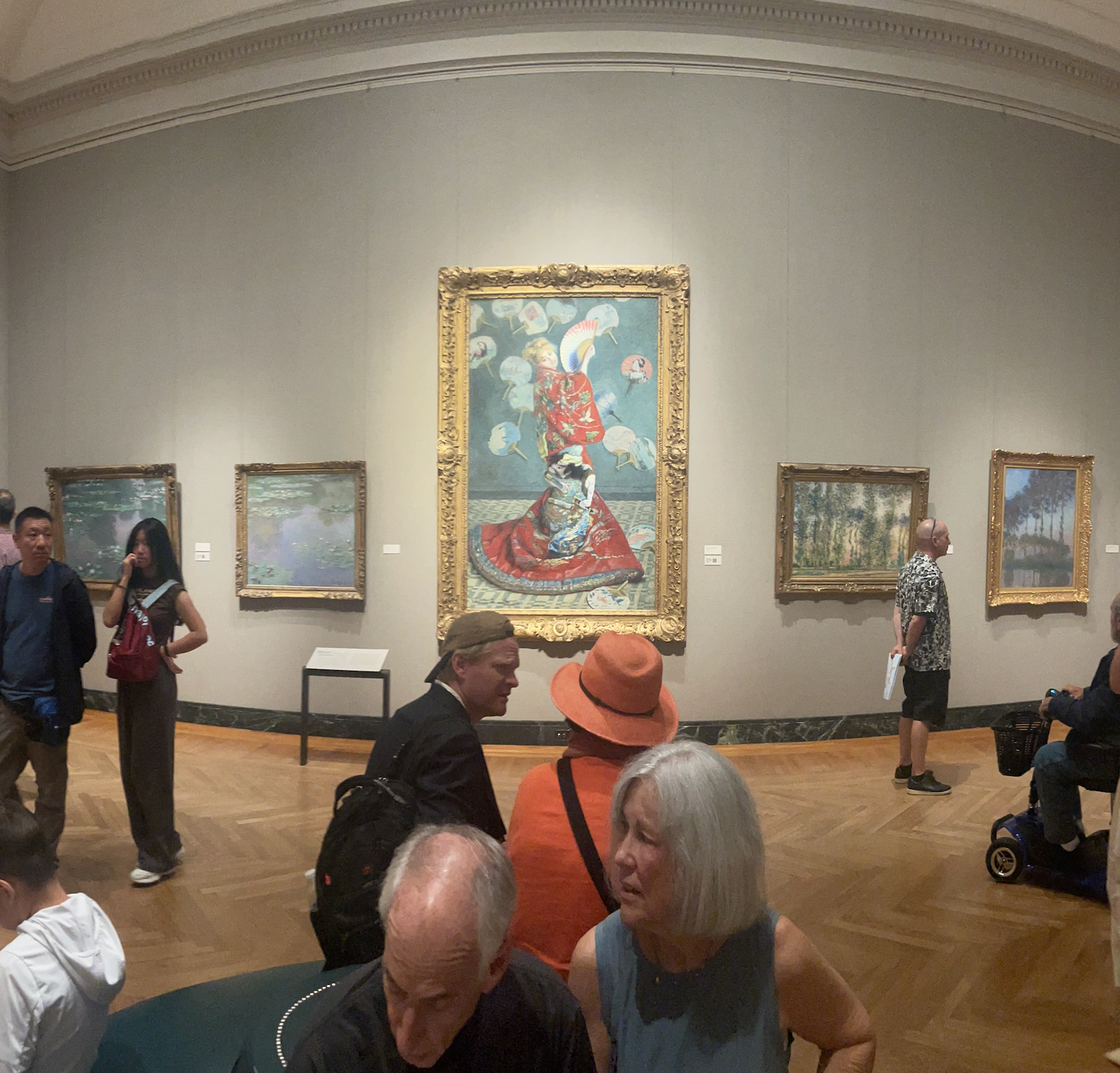 Patrons viewing art in the Monet Gallery at Museum of Fine Arts Boston.